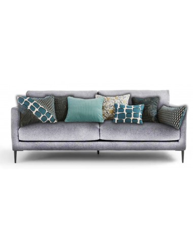 Coussin bleu en velours côtelé sur canapé gris